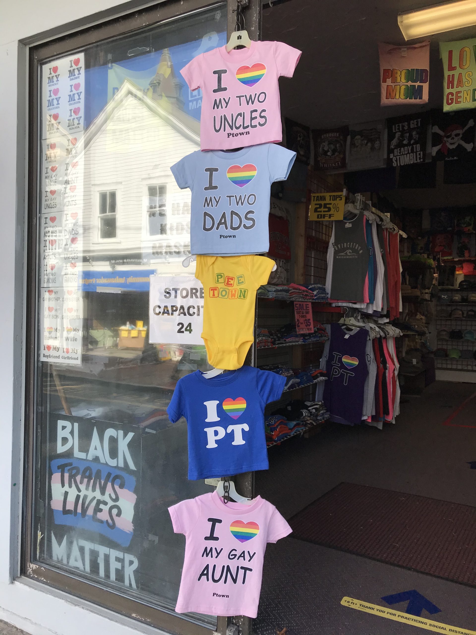 T-shirt store with t-shirt sayings on them that affirm gay people's humanity