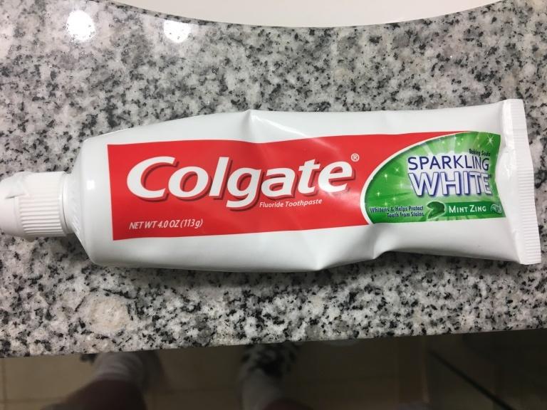 Toothpaste tube squeezed in the middle