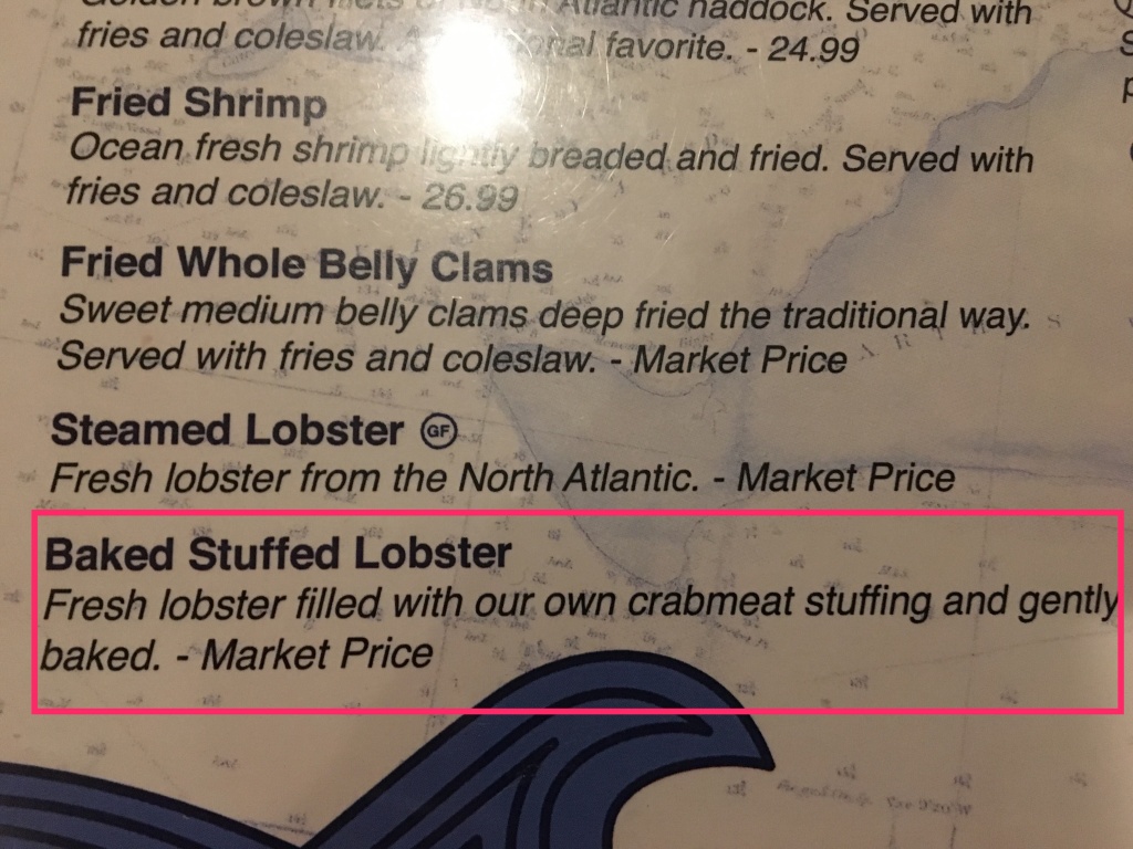 Crab-stuffed lobster menu description
